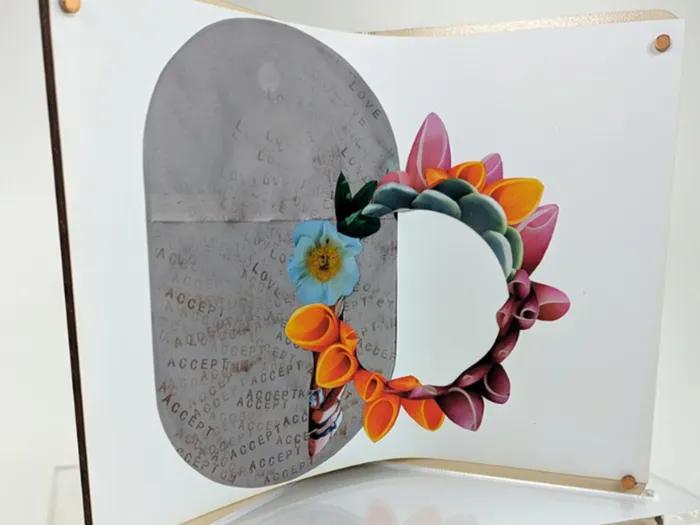art work with flower circle green teal orange yellow pink on display 