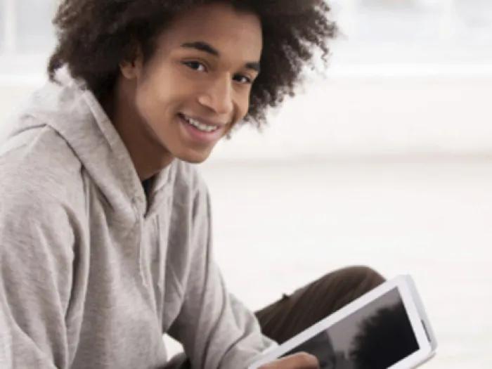 Teen boy smiles at camera