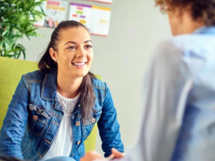 Teen girl speaks with provider