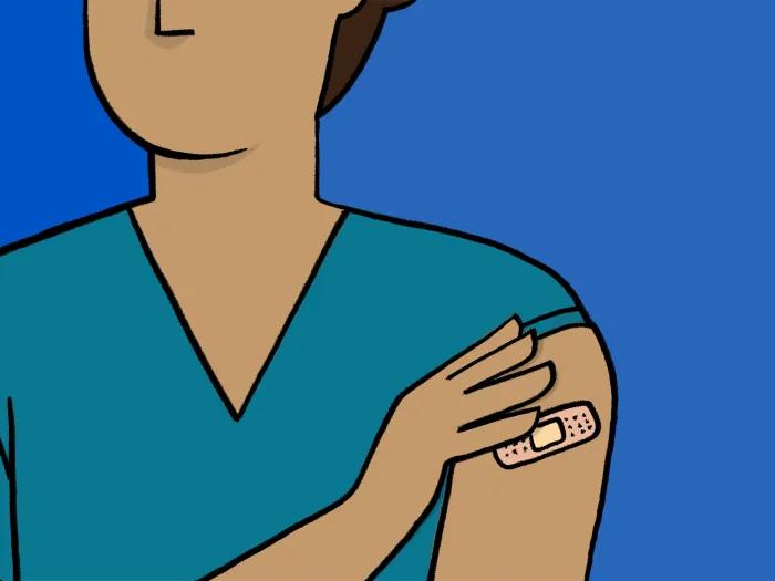 person holding arm with band aid teal shirt