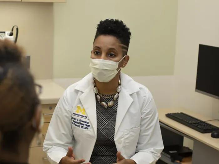 Dr. Versha Pleasant talking with a patient