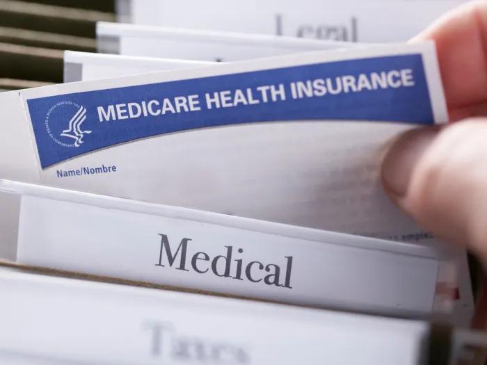 medical files medical health insurance paper someone picking it up