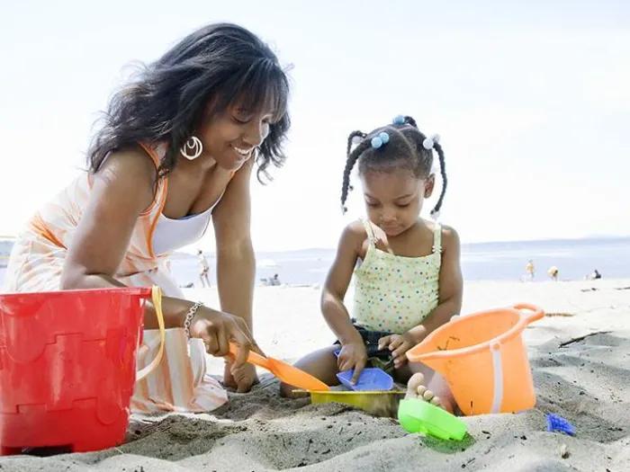 Mother and Child Playing in Sand