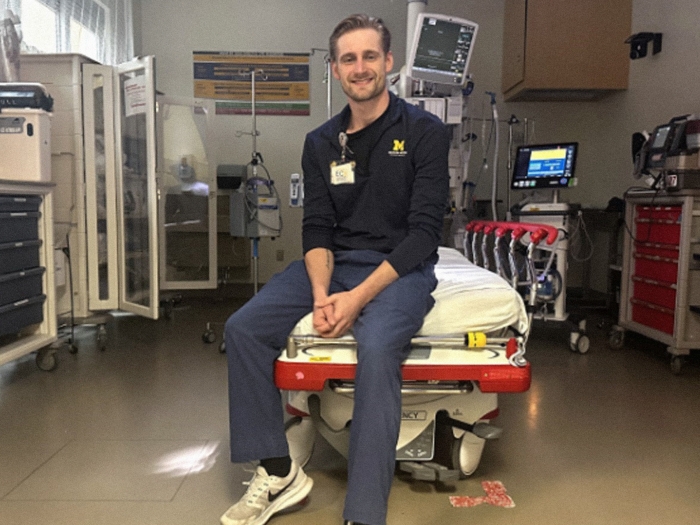 man sitting in ER on bed