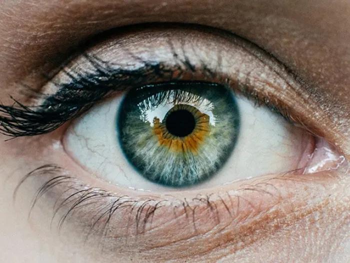 Close up of a hazel green eye