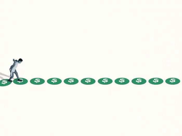 person walking on green circles far away in white space