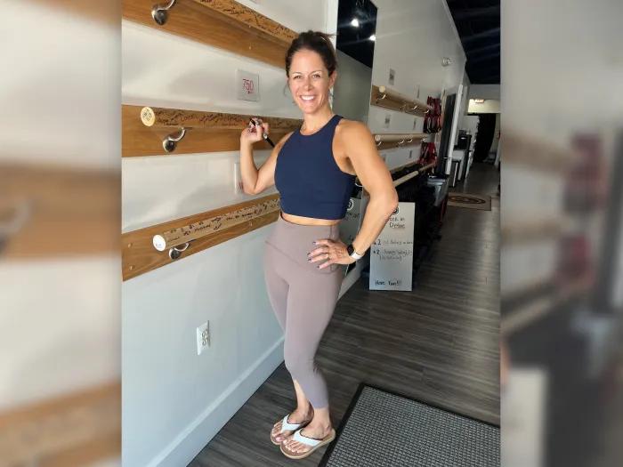 women standing strong in yoga outfit