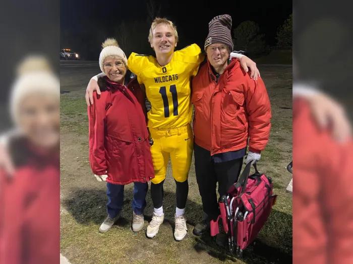 Mathie (left) and her husband (right) at their grandson's football game. Credit: Christine Mathie.