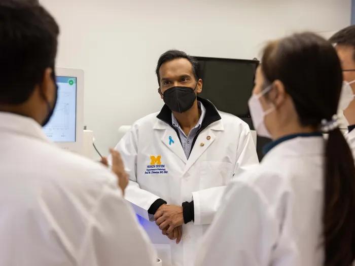 Dr. Chinnaiyan discusses with his team members on data