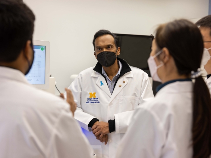 Dr. Chinnaiyan discusses with his team members on data