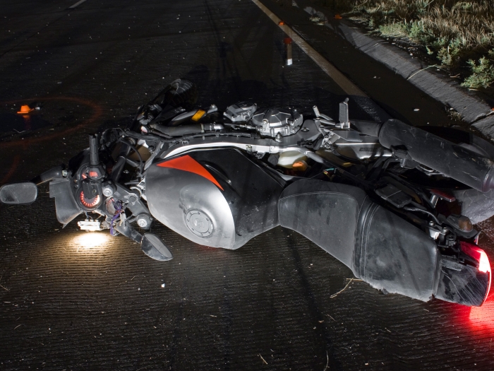 motorcycle on ground in street