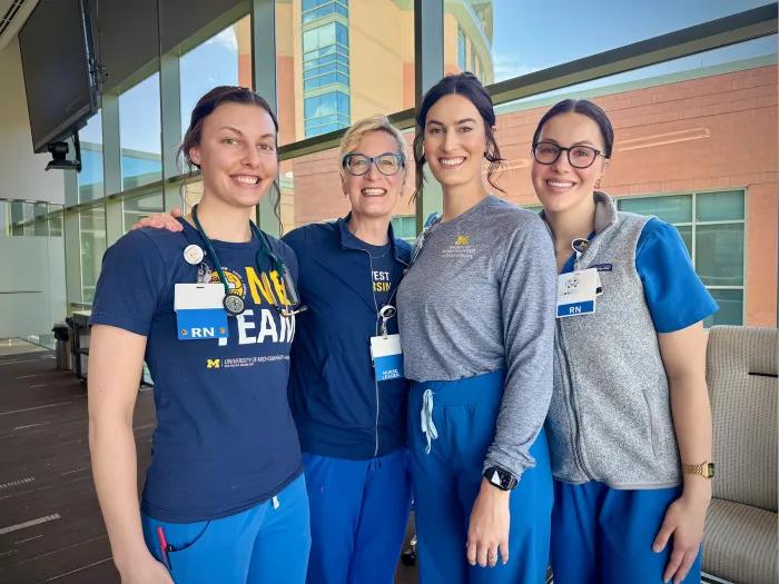 women standing together in nursing uniforms