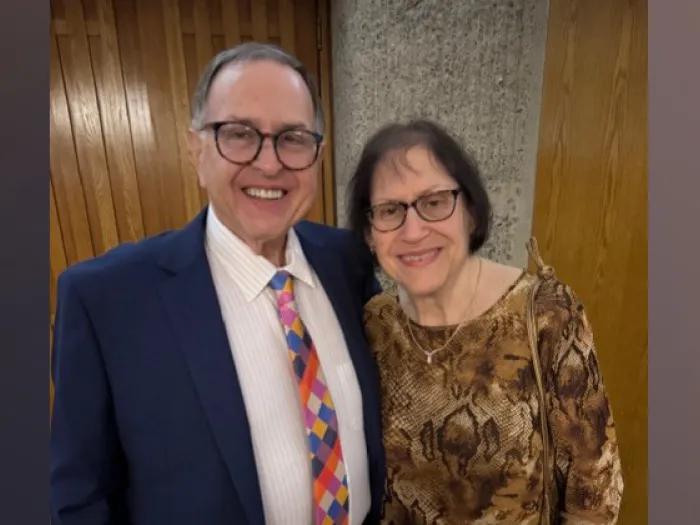 Smiling double portrait of David and Lori Liner standing close together.