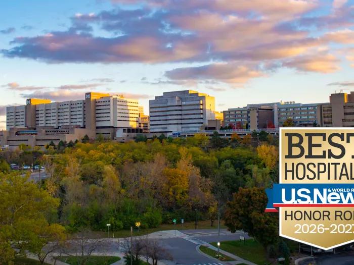 A logo of US News and World Report honor roll 2026-2027 with university of Michigan medical campus.