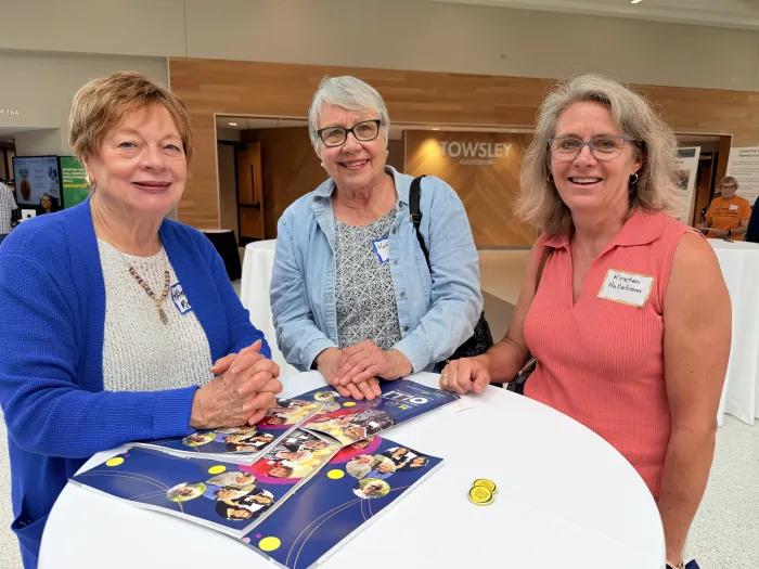 3 OLLI members smile for photo
