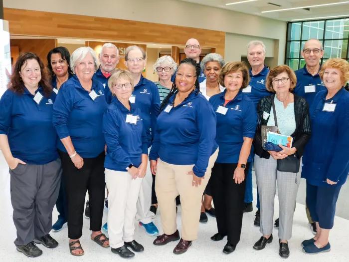 OLLI volunteers pose for group photo