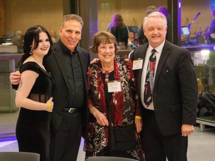 OLLI members smile for photo at formal event