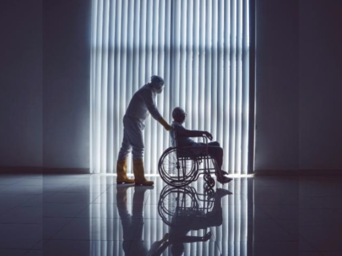COVID_patient_being_pushed_in_wheelchair