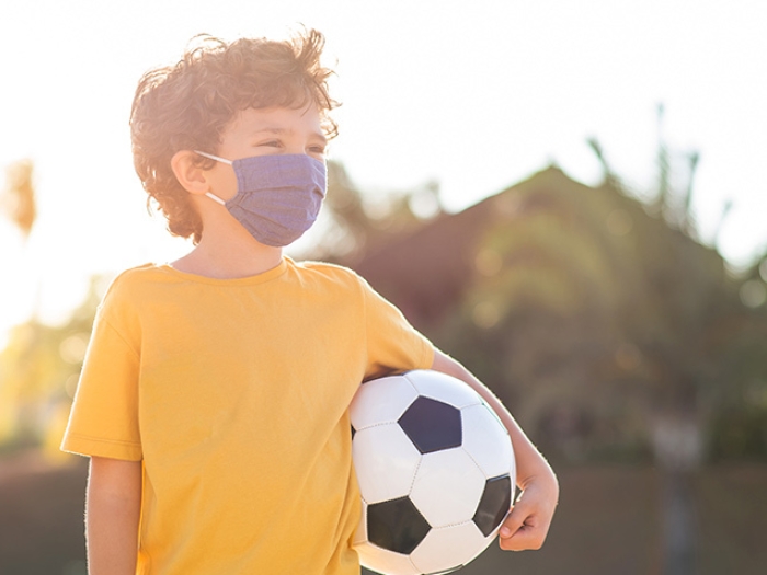 child soccer ball yellow shirt with mask