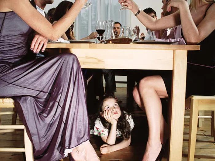 Child under table adult alcohol