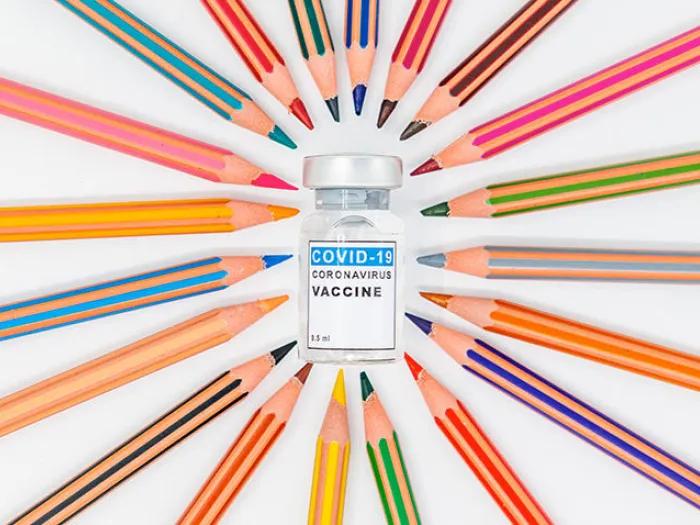 colored pencils coronavirus vaccine vial 
