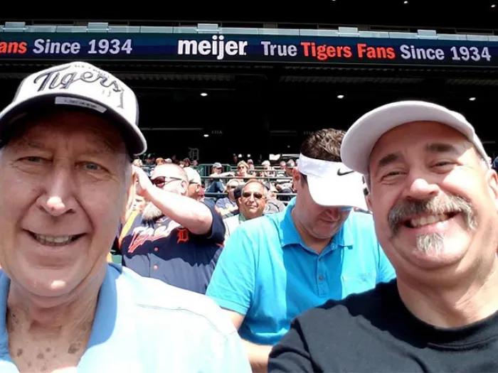 Dad and son at baseball game