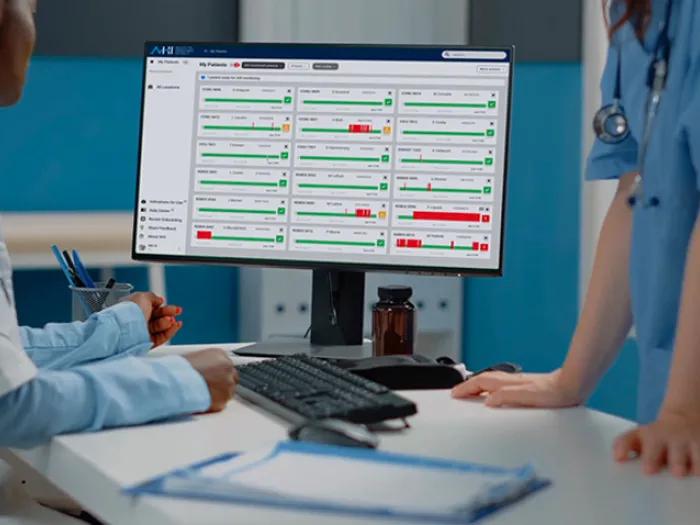 doctor nurse looking at computer screen
