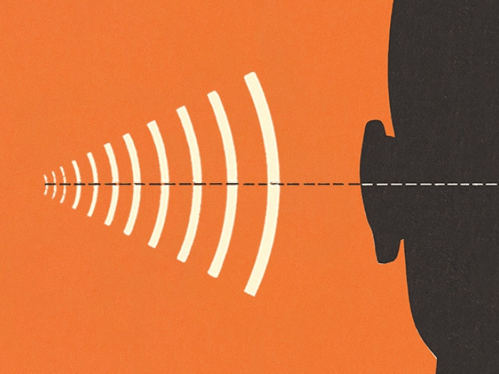 ear listening with orange background and black silhouette 