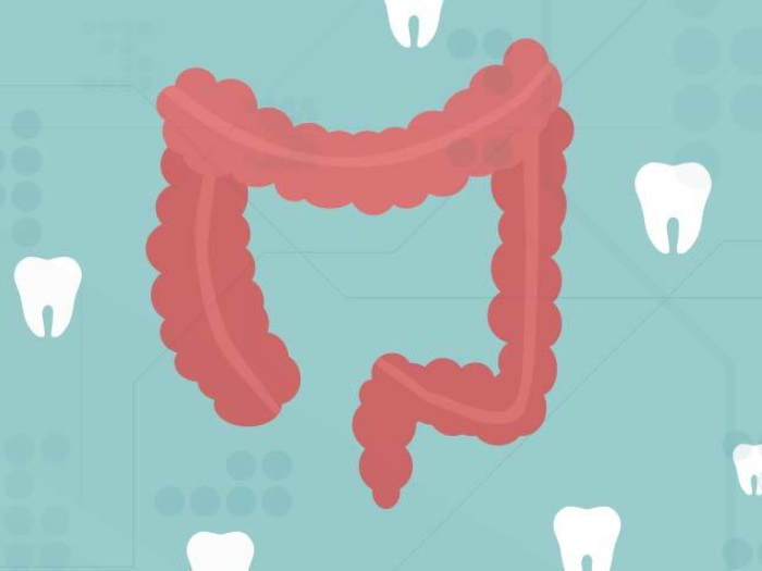 white teeth floating in background of red GI tract on teal blue background