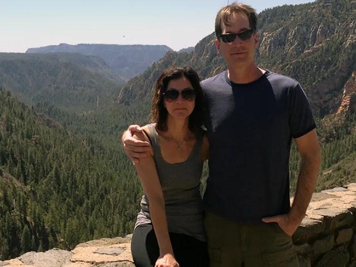Dr. Stephen Chermack and his wife with mountains behind