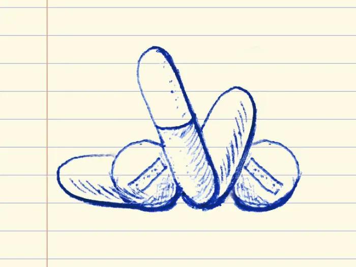 drawing of pills on lined paper in blue ink