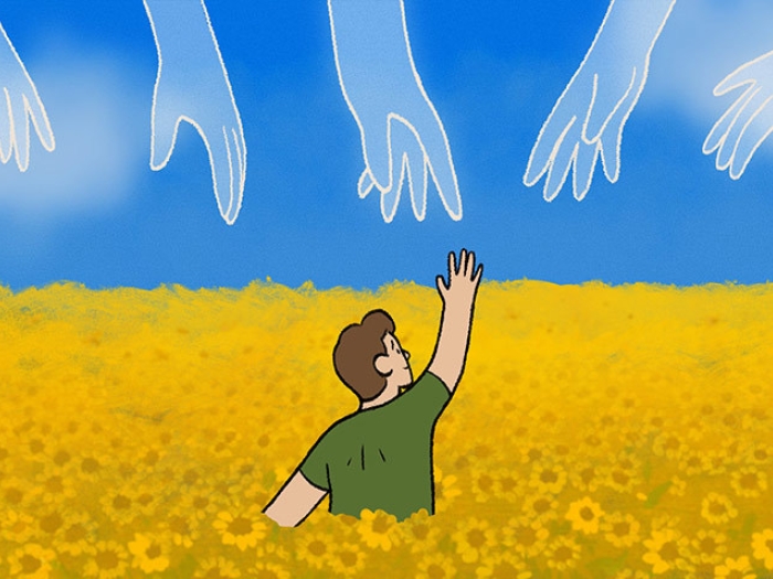 man reaching for sky sunflowers