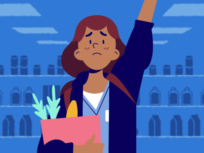 med student raising hand embarrassed holding groceries 