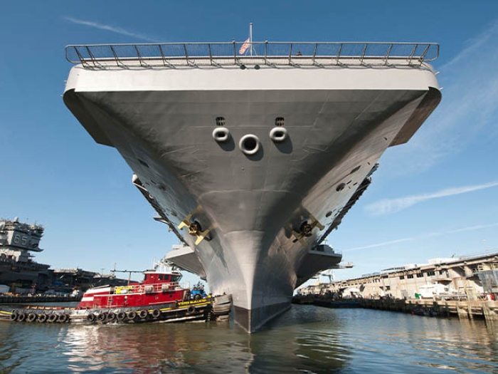 grey navy ship in water 