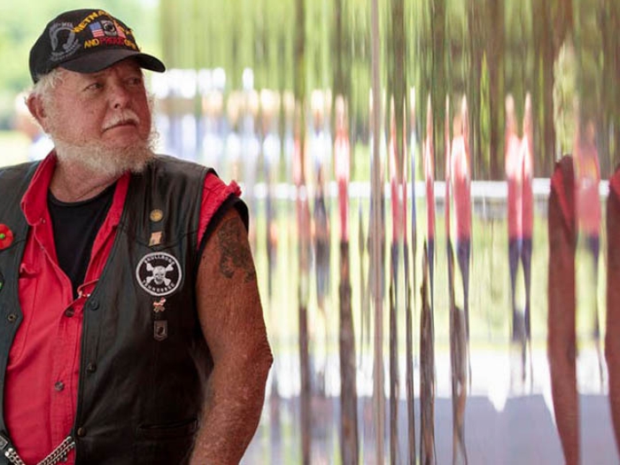 Vietnam veteran Marvin Nolin of Dover, Tenn., visits the Poppy Wall of Honor on the National Mall in Washington.