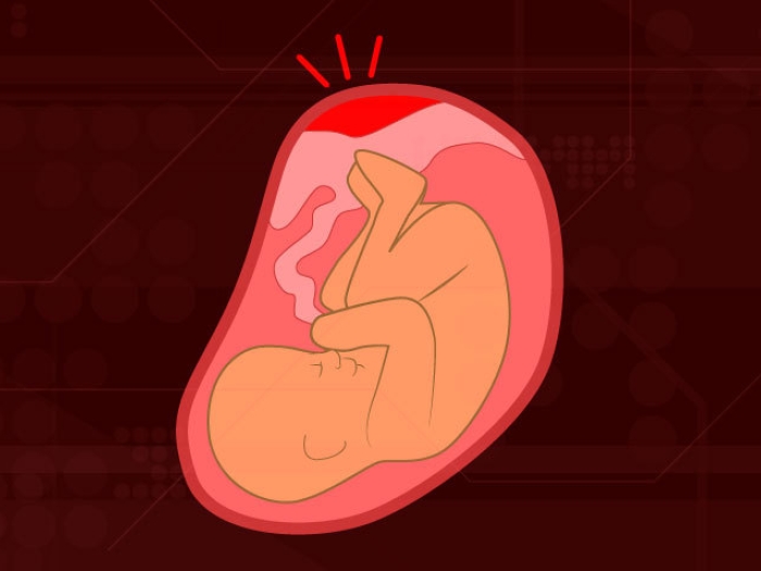 black background baby in red placenta with red spot at top signaling something is wrong