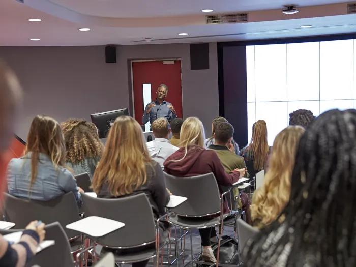 A postdoctoral fellow teaching a class as part of the IRACDA program