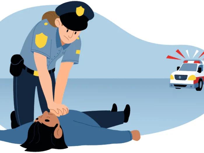 Police officer in uniform performing CPR to person lying on ground. Ambulance in  background.