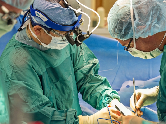 Surgeons inserting a LVAD into a patient