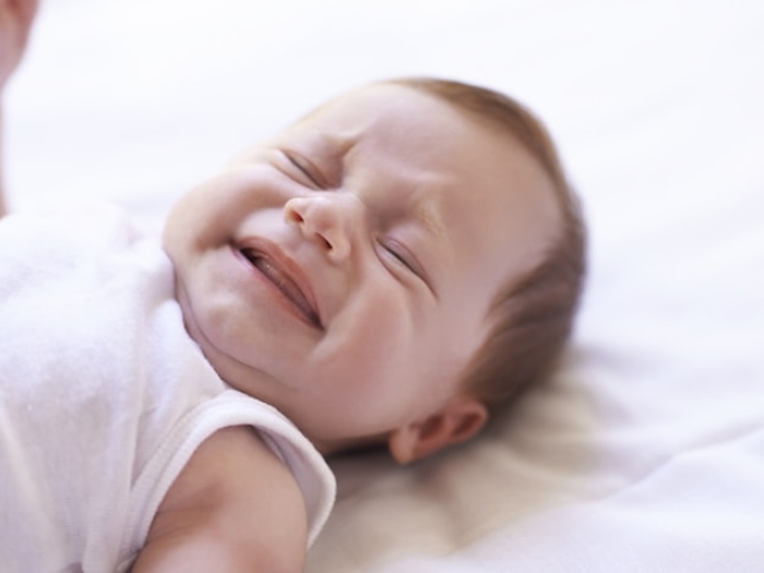 crying baby laying down