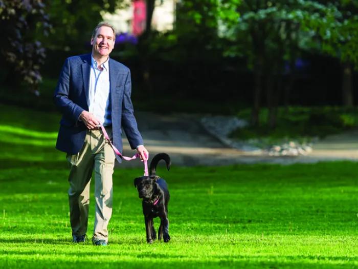 Eric Barth walking his dog after recovering from a drug-induced liver injury from Z-Paks