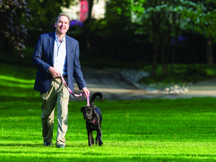 Eric Barth walking his dog after recovering from a drug-induced liver injury from Z-Paks