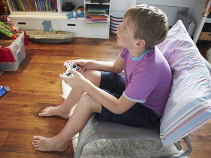 A young boy playing video games