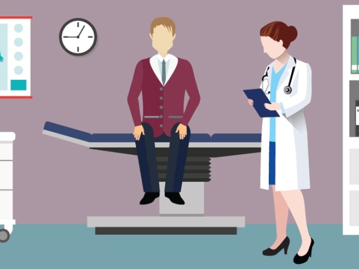 image of guy with female doctor in doctor&#039;s office