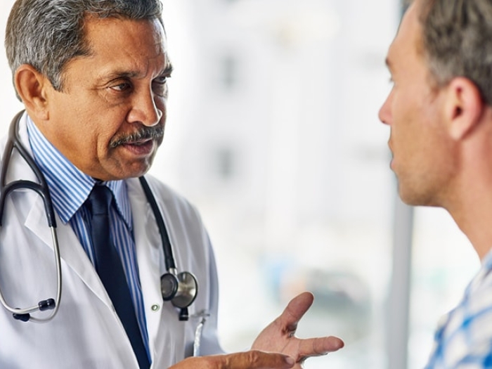 A doctor talking to a patient about prostate cancer
