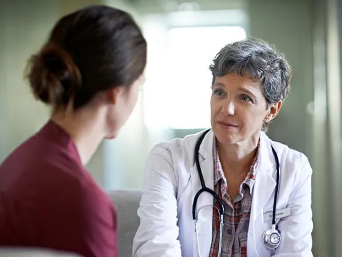 A breast cancer patient deciding whether to get implant reconstruction to autologous reconstruction