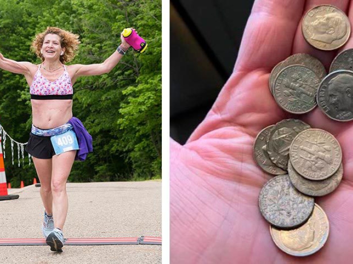Woman marathon running with handful of dimes