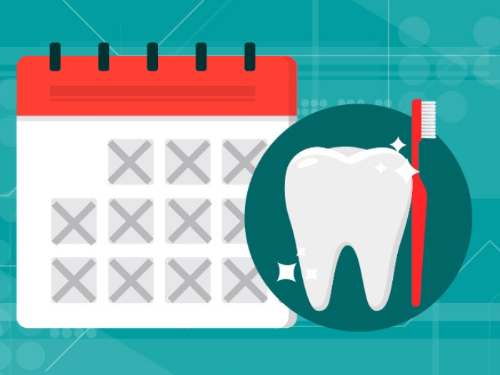 calendar with tooth and red toothbrush with teal background 