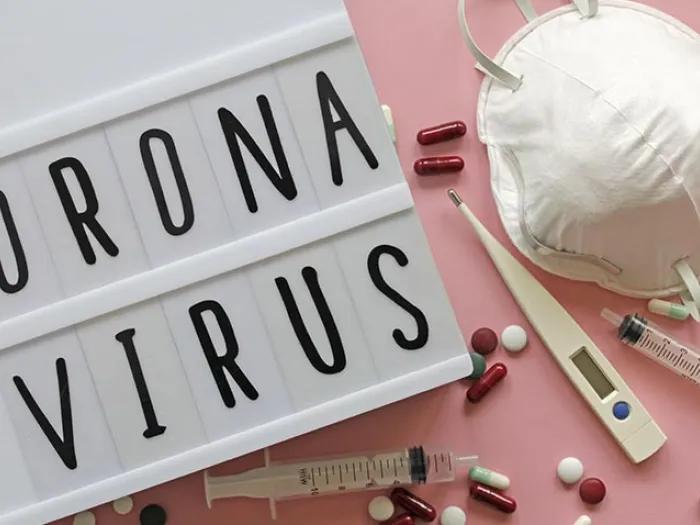 Coronavirus sign with pills and face mask