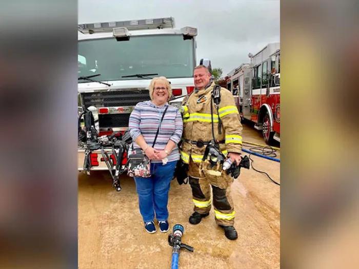 Firefighter in front of fire truck